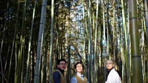 A monk and Templestay participants on a forest path