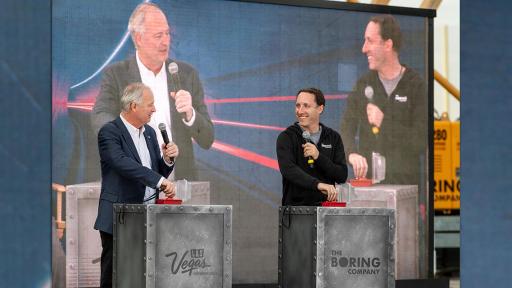 Speakers talking on a stage.