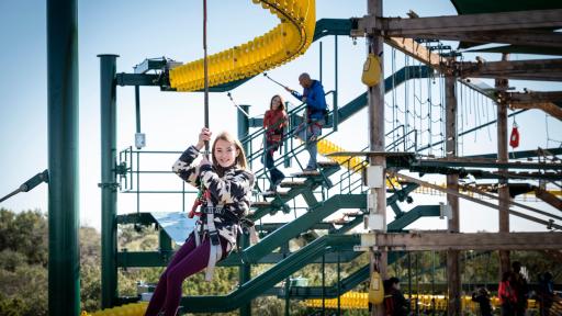 People zip-lining