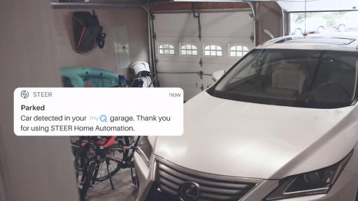 Car in garage with app window saying Parked