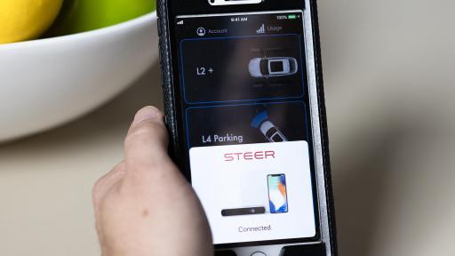 Smart phone with steer app window on it.