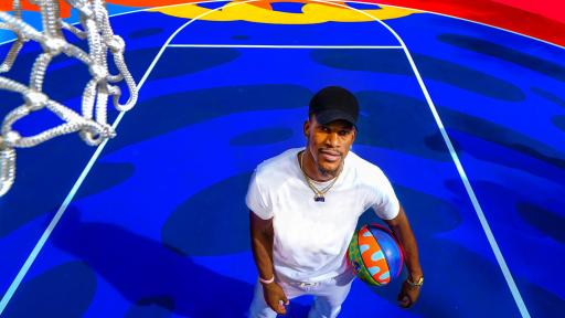 Man standing on basketball court with a basketball