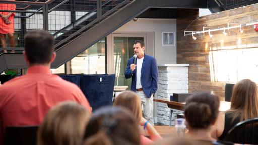 People listening to a speaker