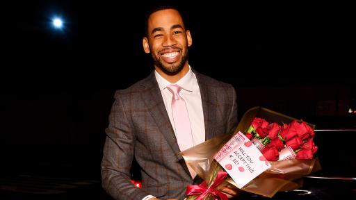 Mike Johnson holding a bouquet of roses