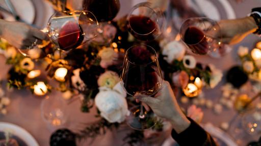 Shot of glasses of whine in a toast.