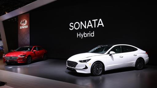A white 2020 Hyundai Sonata Hybrid on stage