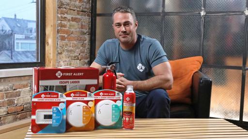 Man with First Alert Home Safety products