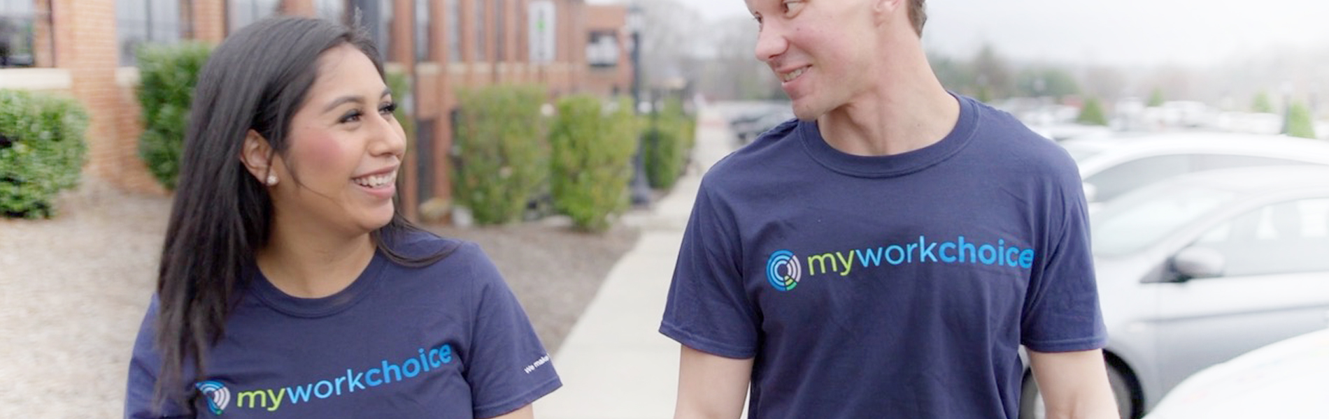 Banner image of two people walking together wearing MyWorkChoice t-shirts