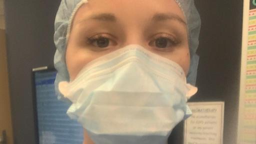 Nurse in medical garb and mask