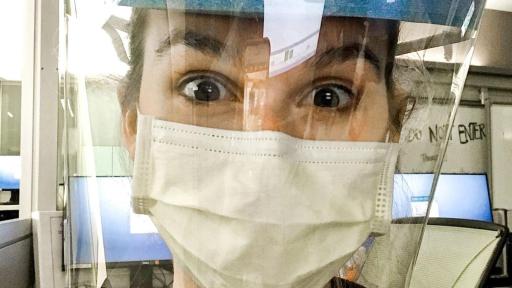 Nurse in medical garb and face sheild