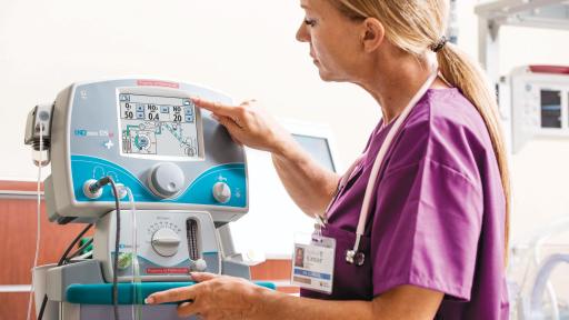 Woman working with a machine.