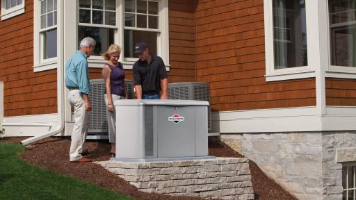 Dealer installing generator on the side of a house