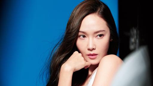 Jessica Jung against a blue background