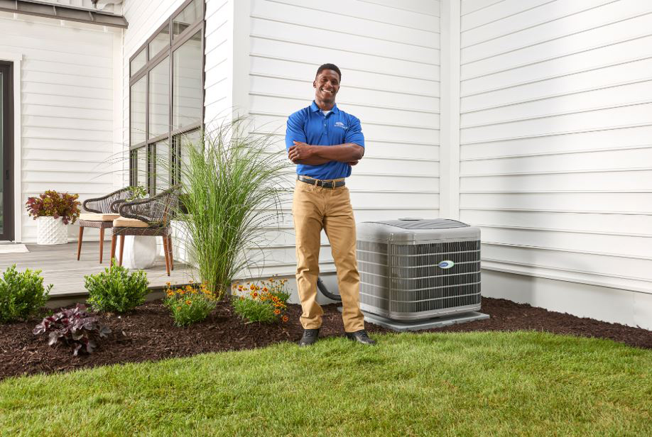 Man standing next to an HVAC unit