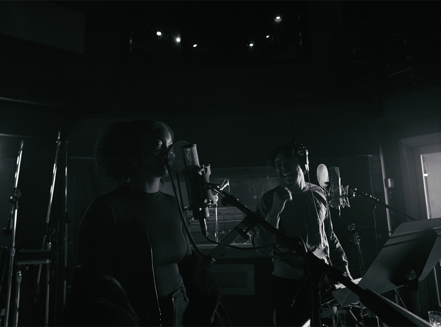Black and white photograph of a man singing