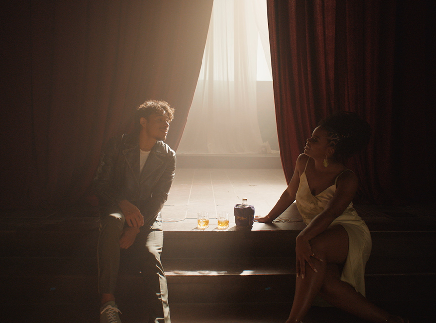 Man and woman sitting on a stage
