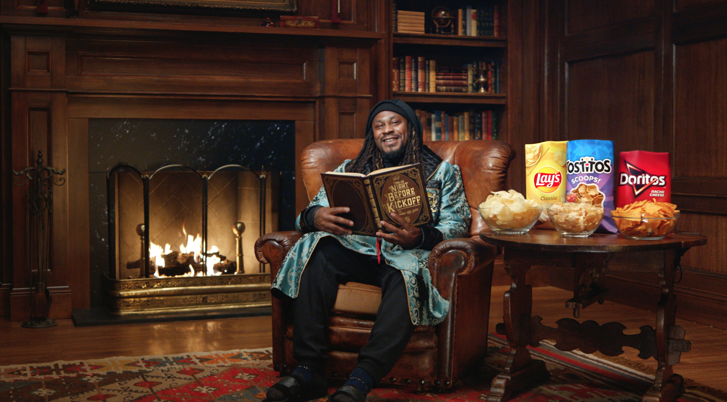 Marshawn reading in a chair