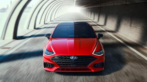 The Sonata N Line front of red car