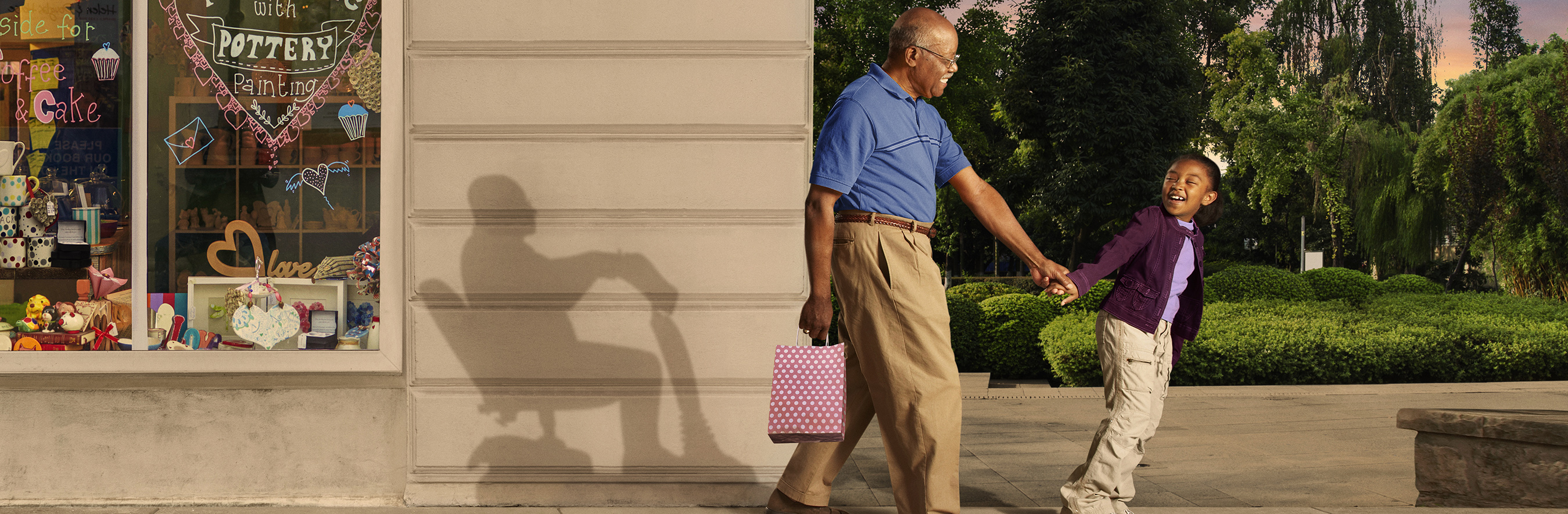 Man walking with child outside a bakery