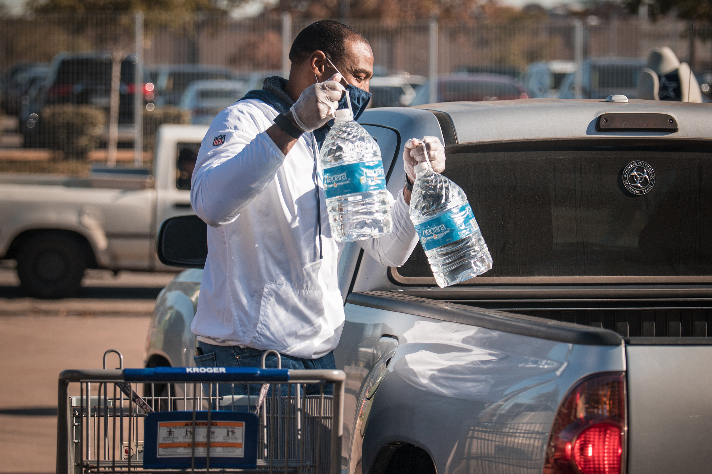 Man loading water into a truck
