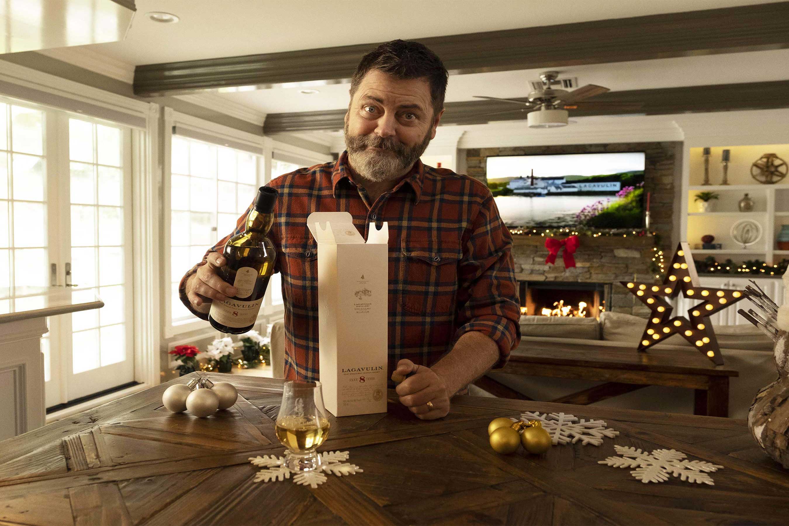Actor Nick Offerman pouring a glass of Lagavulin Single Malt