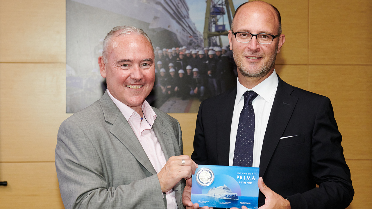 In keeping with maritime tradition, Norwegian Cruise Line hosts a commemorative coin ceremony to celebrate the float out construction milestone for its game-changing new ship Norwegian Prima. In attendance were executives from NCL and shipbuilder Fincantieri, including Eamonn Ferrin, NCL Vice President of International Business and Emanuele Truant, Norwegian Prima Project Manager of Fincantieri. Photo by ©Filippo Vinardi.