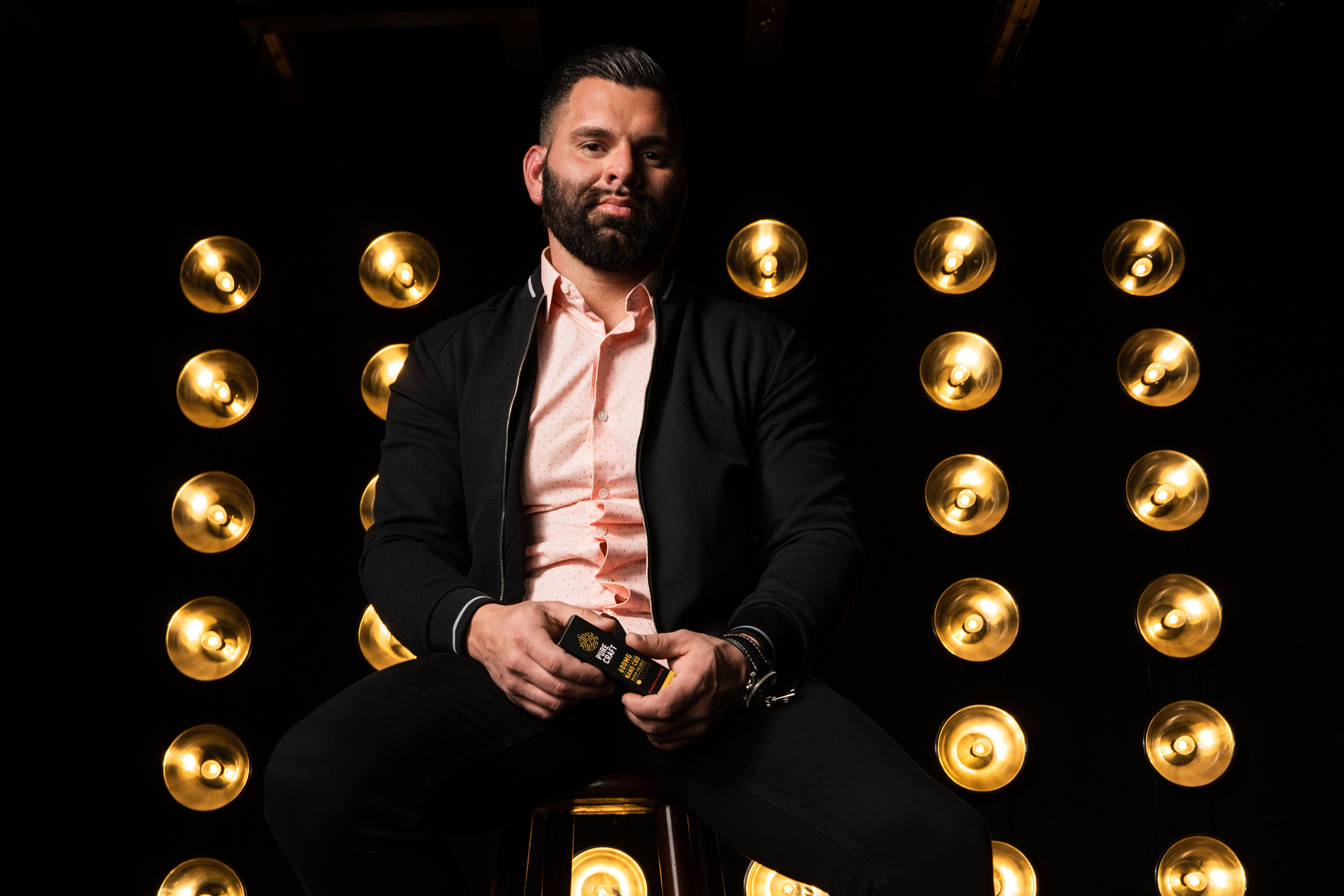 Jason holding product forward