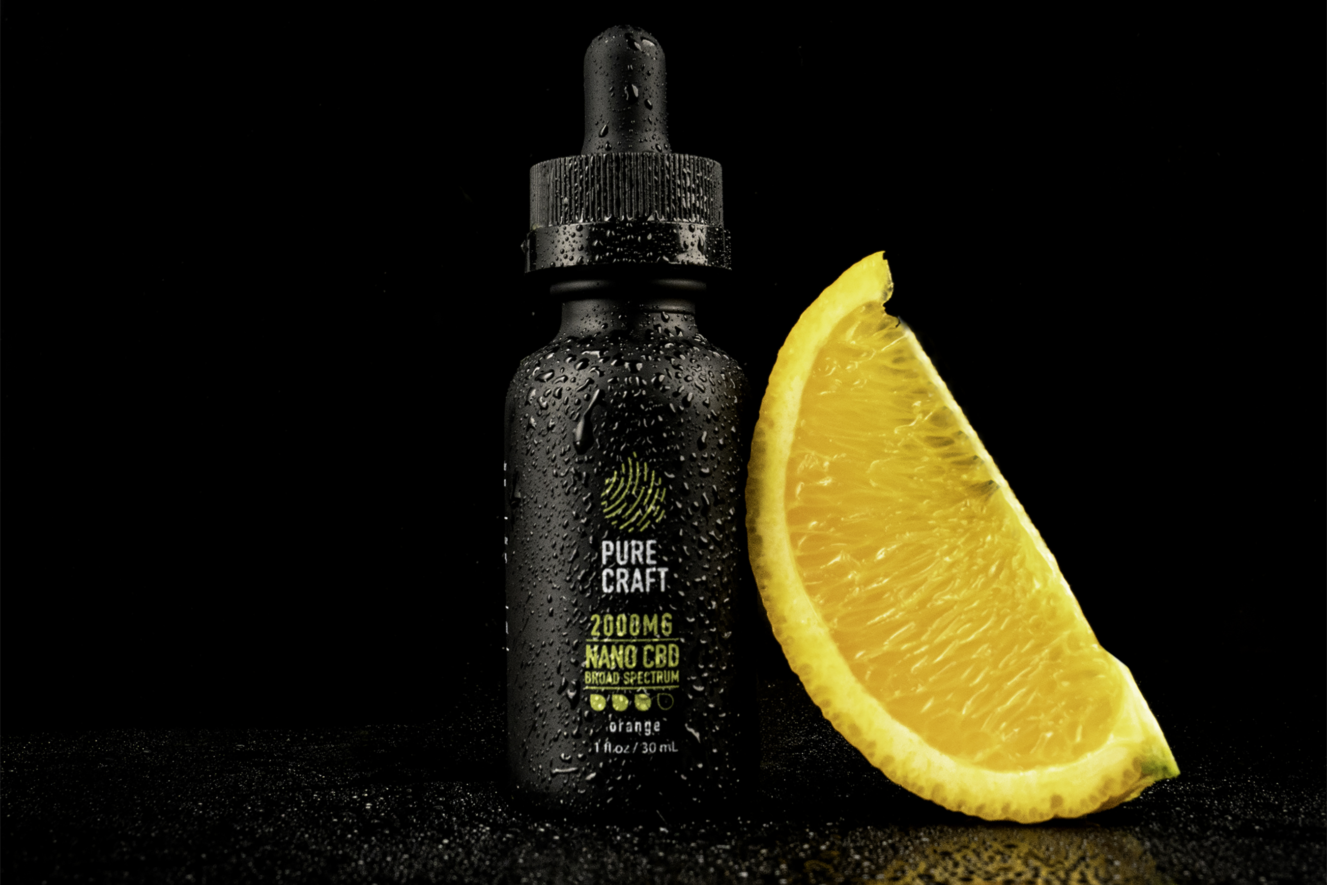 black bottle and orange slice