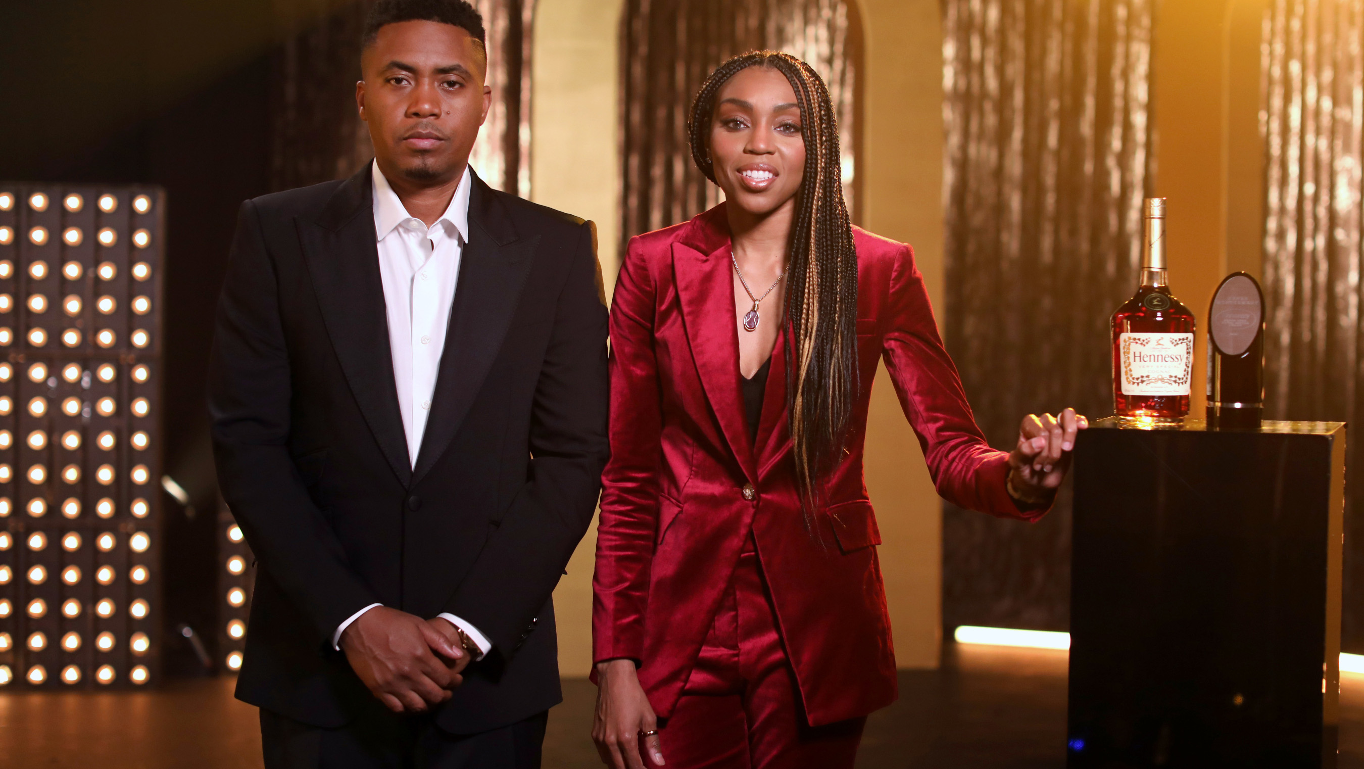 Nas, standing beside Renee Montgomery