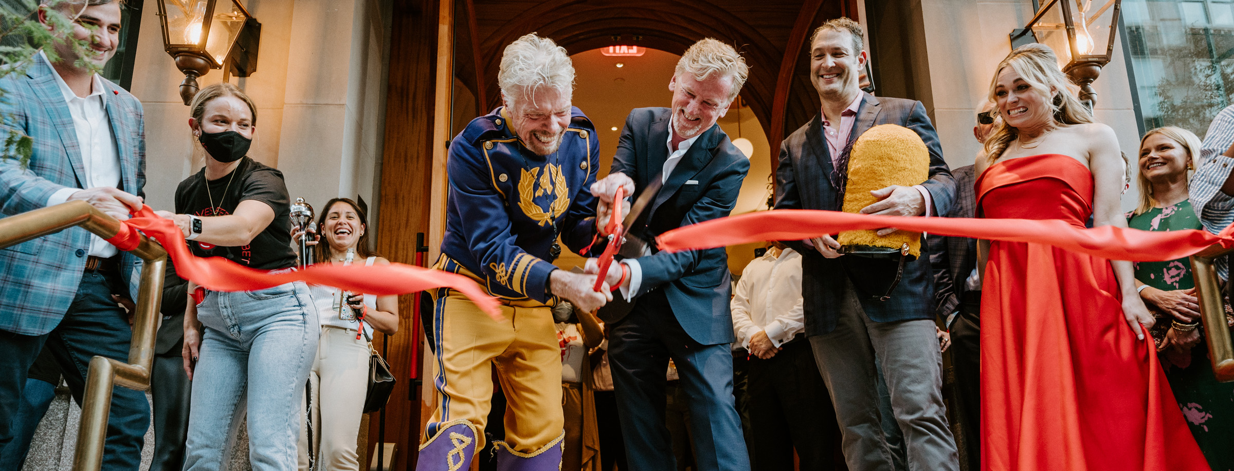 Richard Branson Cutting a ribbon