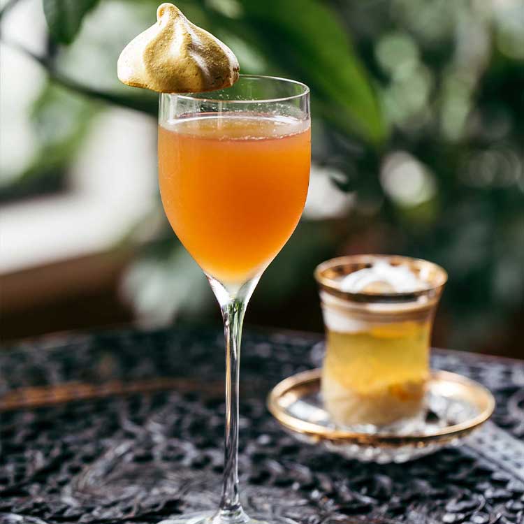 two mixed drinks on a table