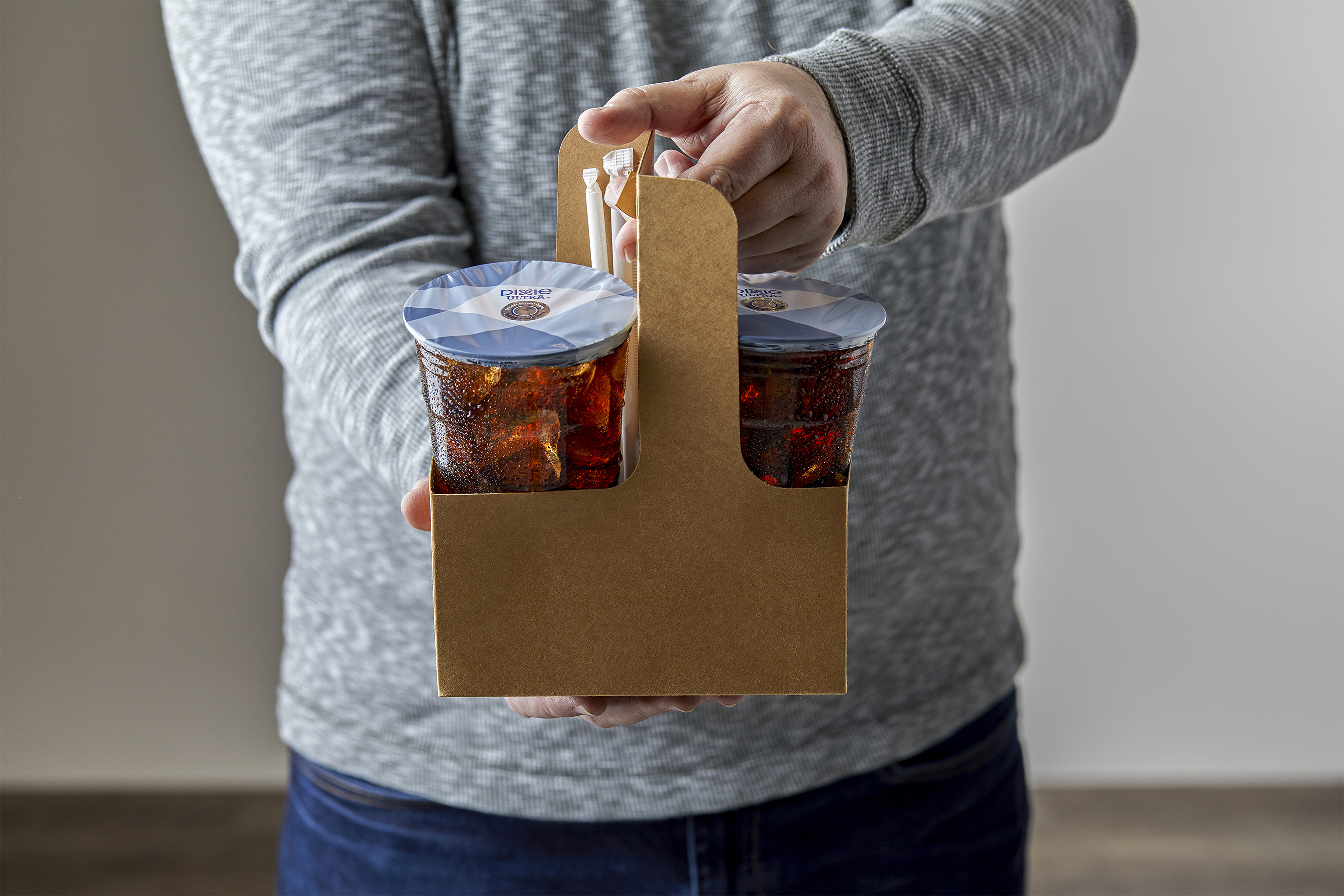 Person holding drinks