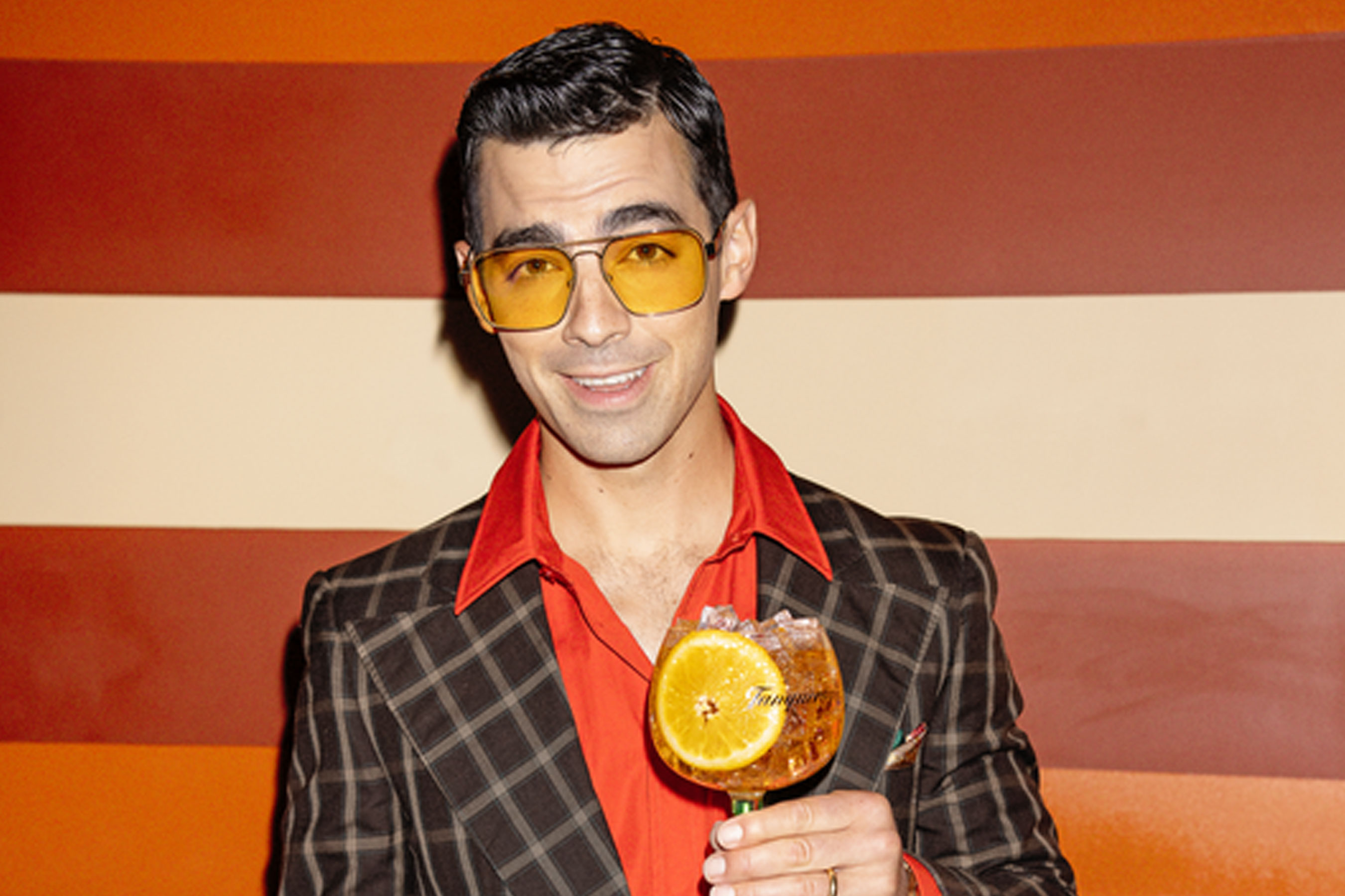 Joe Jonas posing with Tanqueray