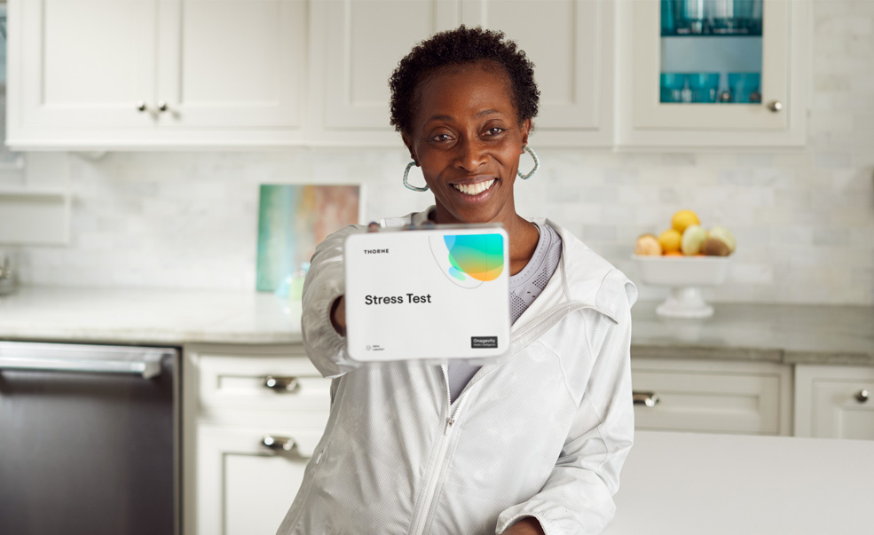 Gail Devers holding package of vitamins