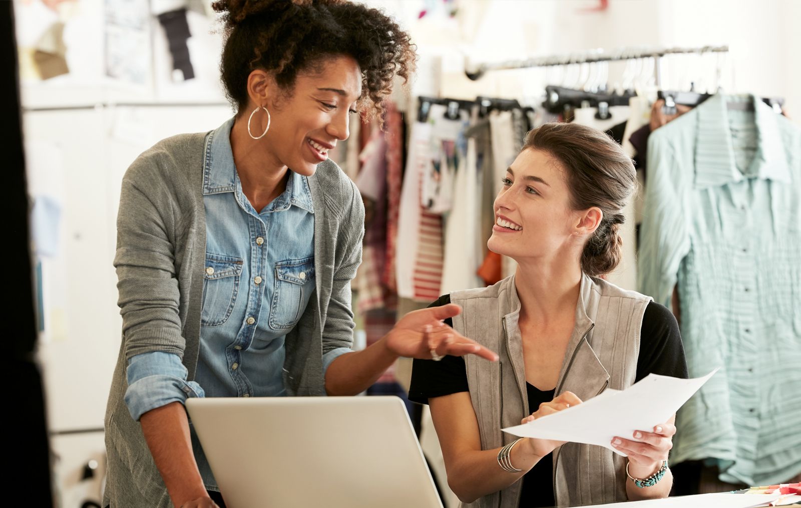 Two Women Talking and looking at a computer