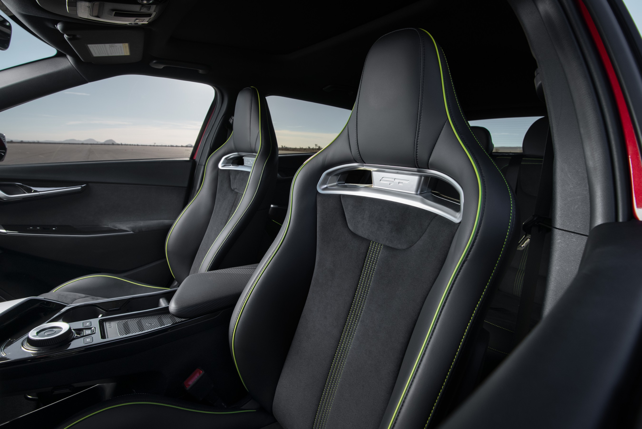 Kia’s EV6 GT driver-focused cabin enhancements include unique, racing-inspired sport bucket seats and neon green dash accents.