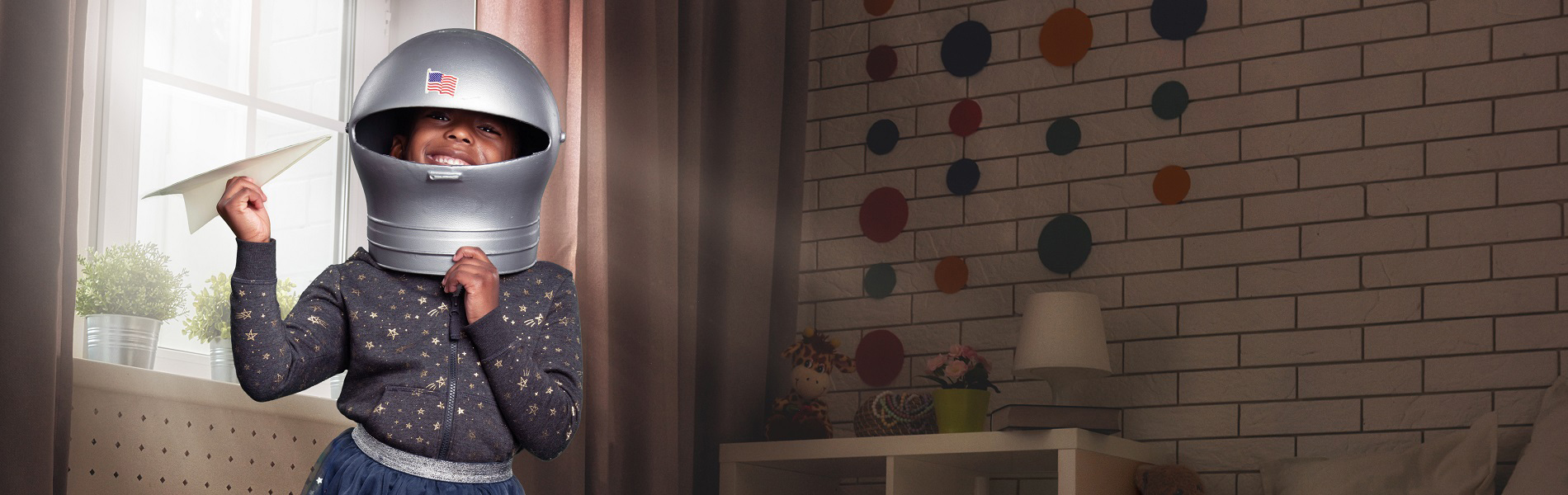 Girl throwing paper airplane