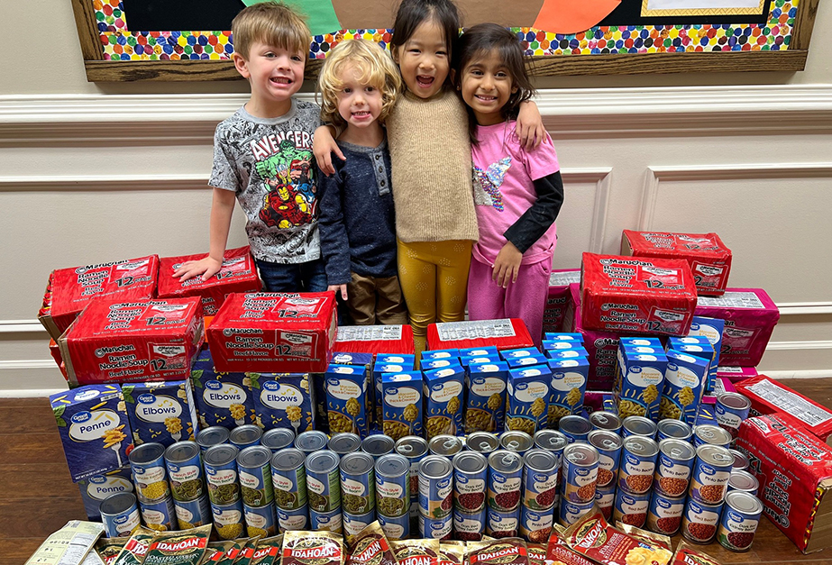 Primrose School of Johns Creek (Suwanee, GA) students help assemble their school’s donated food items for the annual Caring and Giving Food Drive.