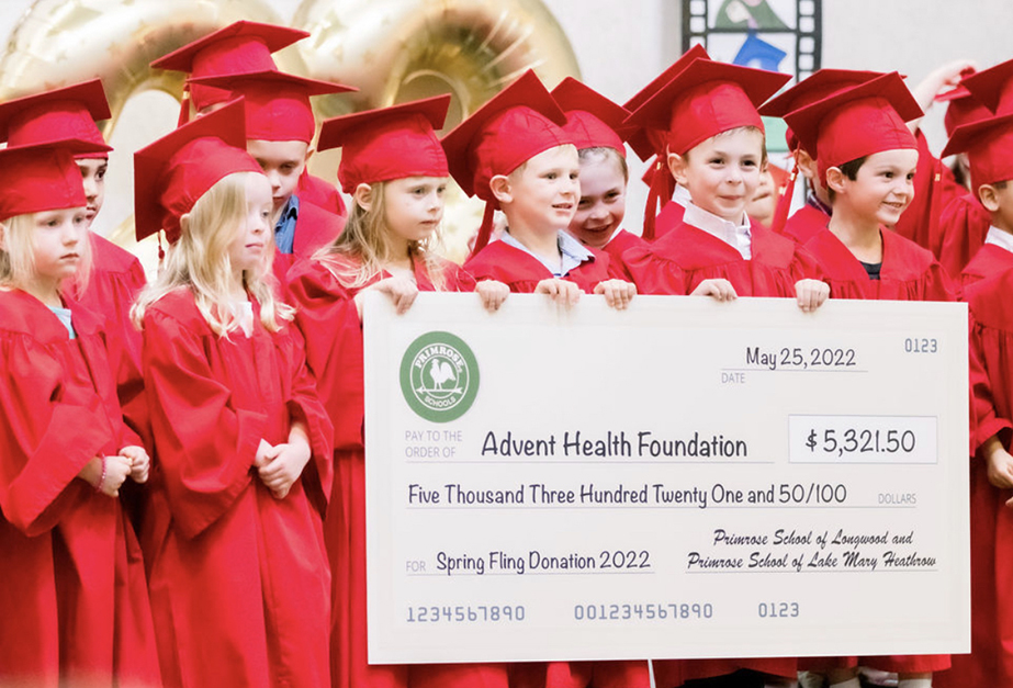 Students at Primrose Schools of Lake Mary Heathrow (Sanford, FL) and Longwood at Wekiva Springs (Longwood, FL) announce over $5,000 donation to the Advent Health foundation at graduation.