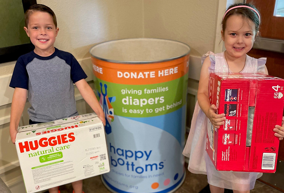 Students at Primrose School of Ward Parkway (Kansas City, MO) assemble donation items for the school’s diaper drive.