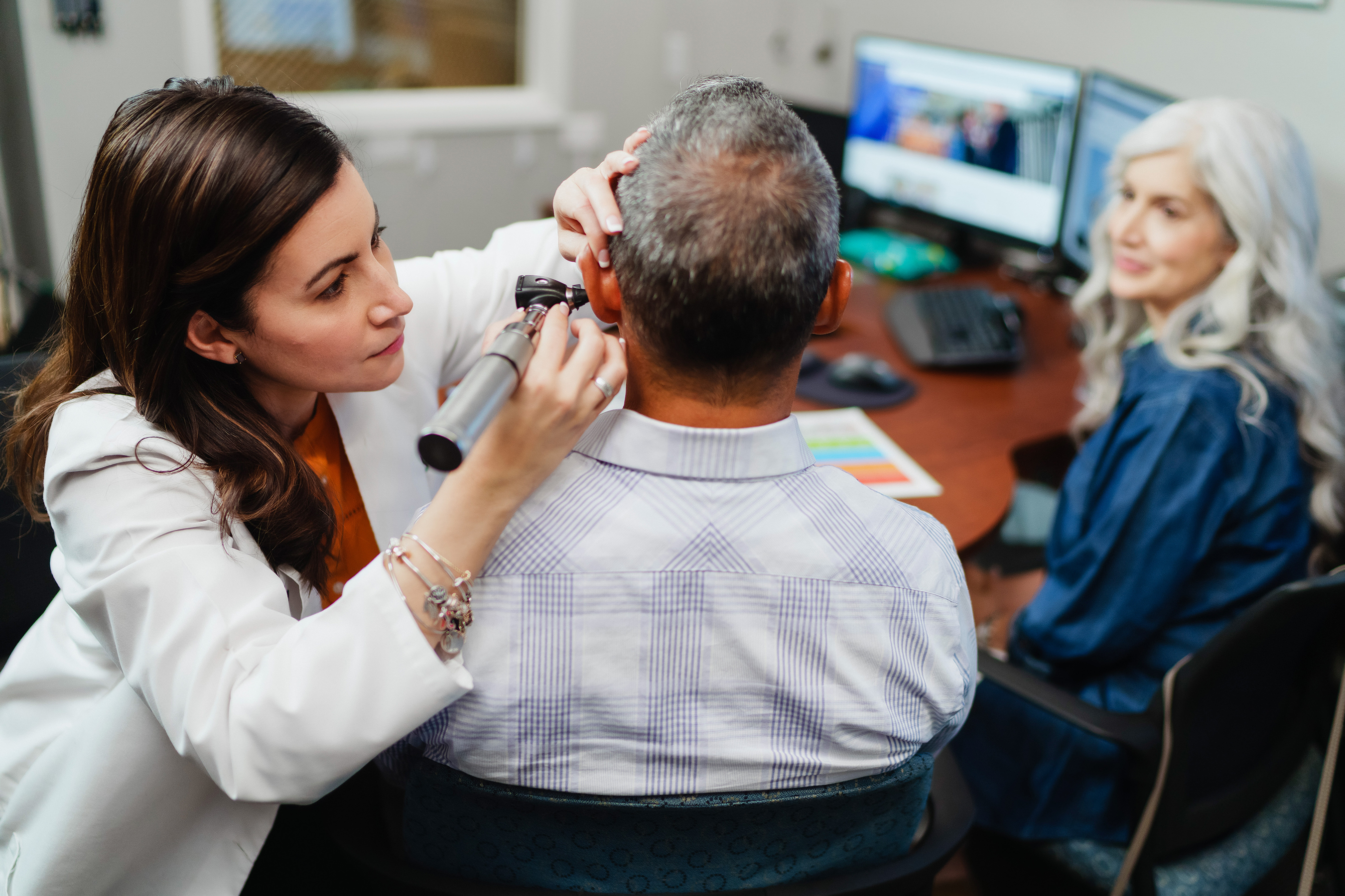 Patient and Beltone Hearing Care Practitioner during evaluation