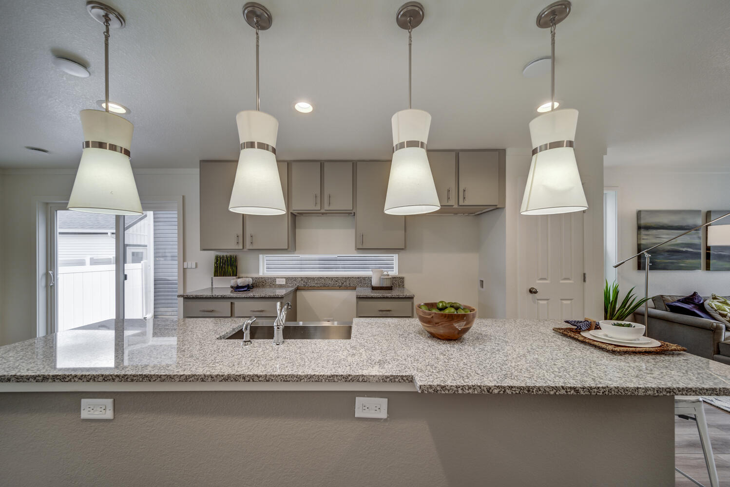 On2 Homes feature spacious kitchens with beautiful cabinetry and stone surfaces.