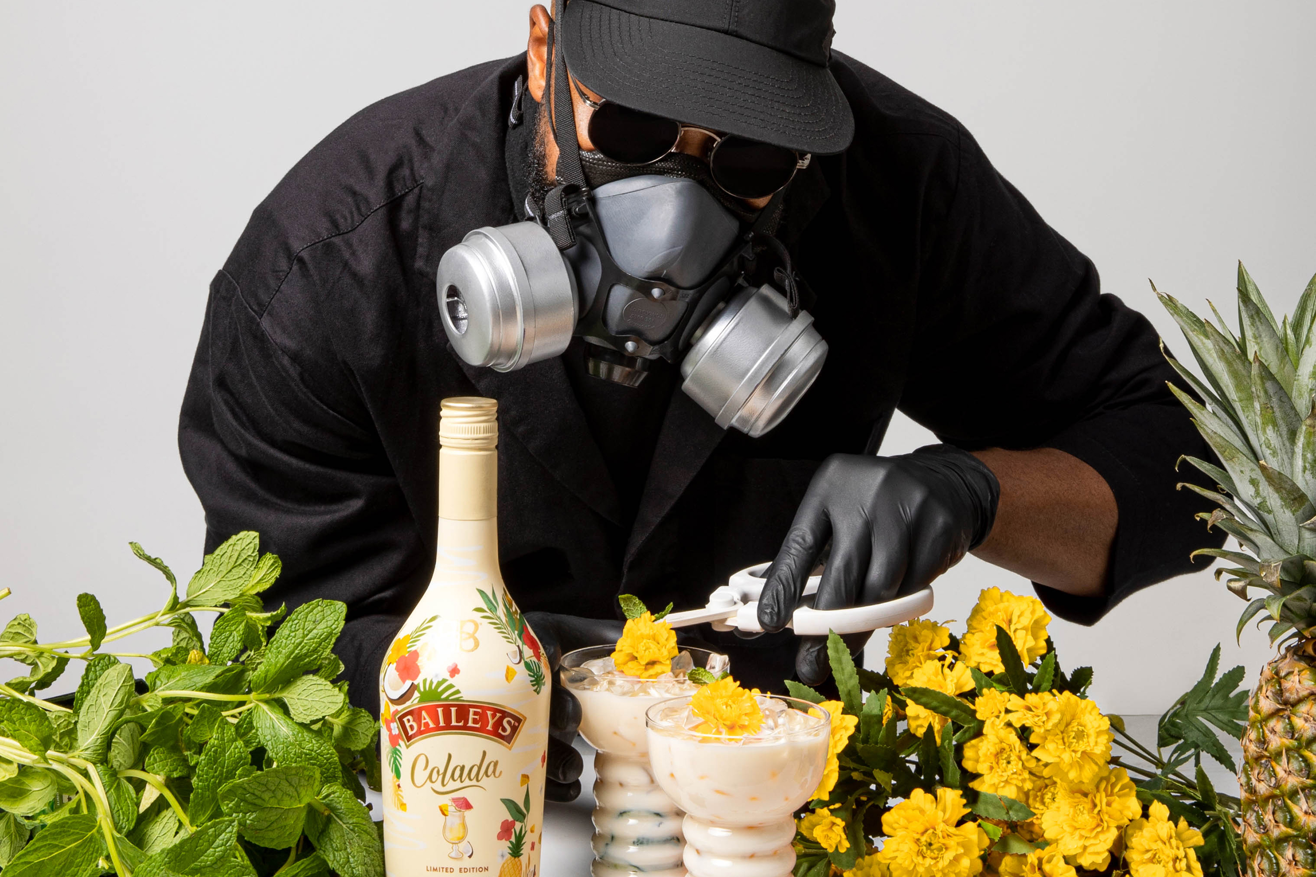 Mr. Flower Fantastic Pairs the Minty Co-La La with an marigold and mint pineapple floral garnish