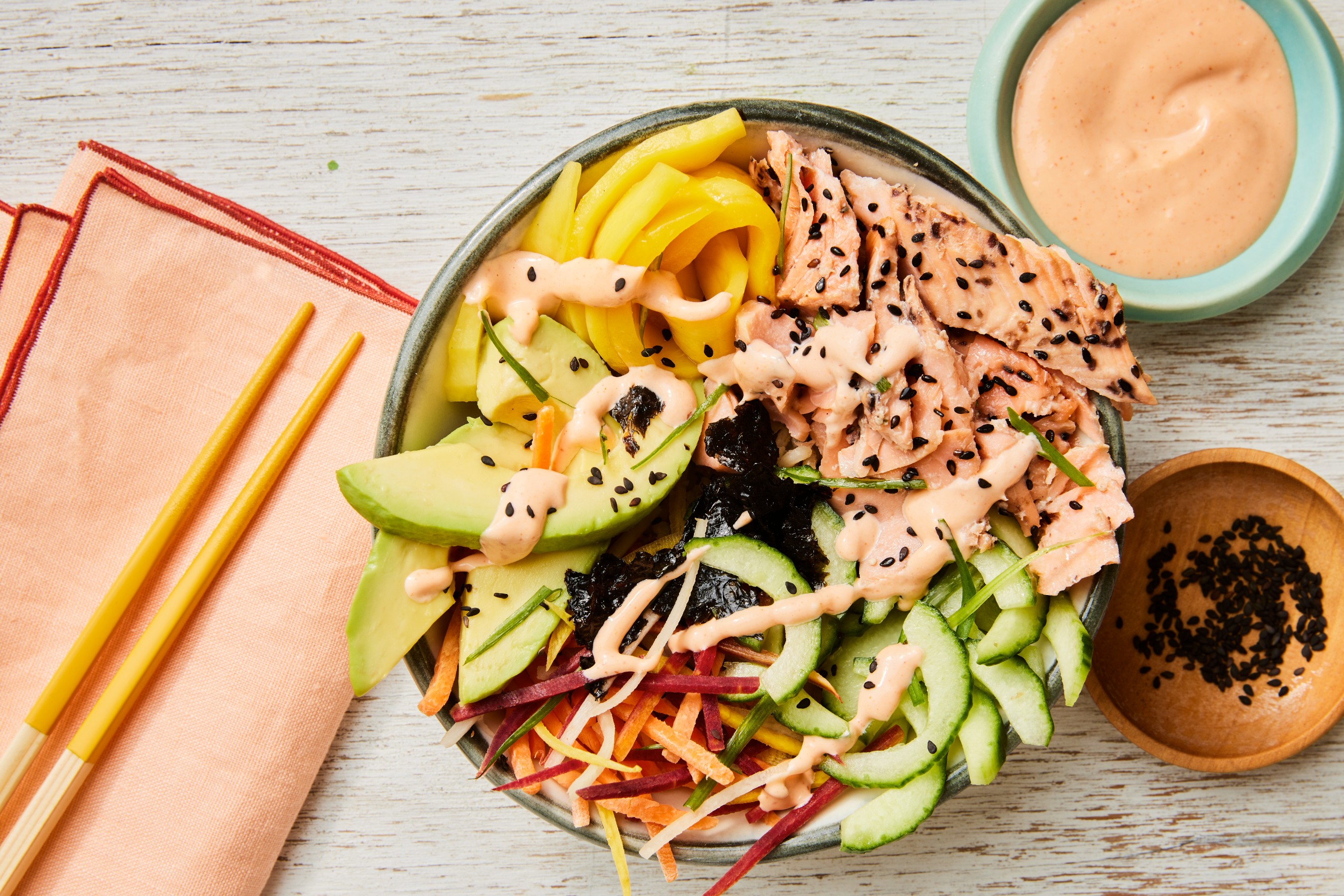 Salmon Sushi Bowls are bursting with healthy ingredients—flaky salmon, nutty brown rice & rich avocado.