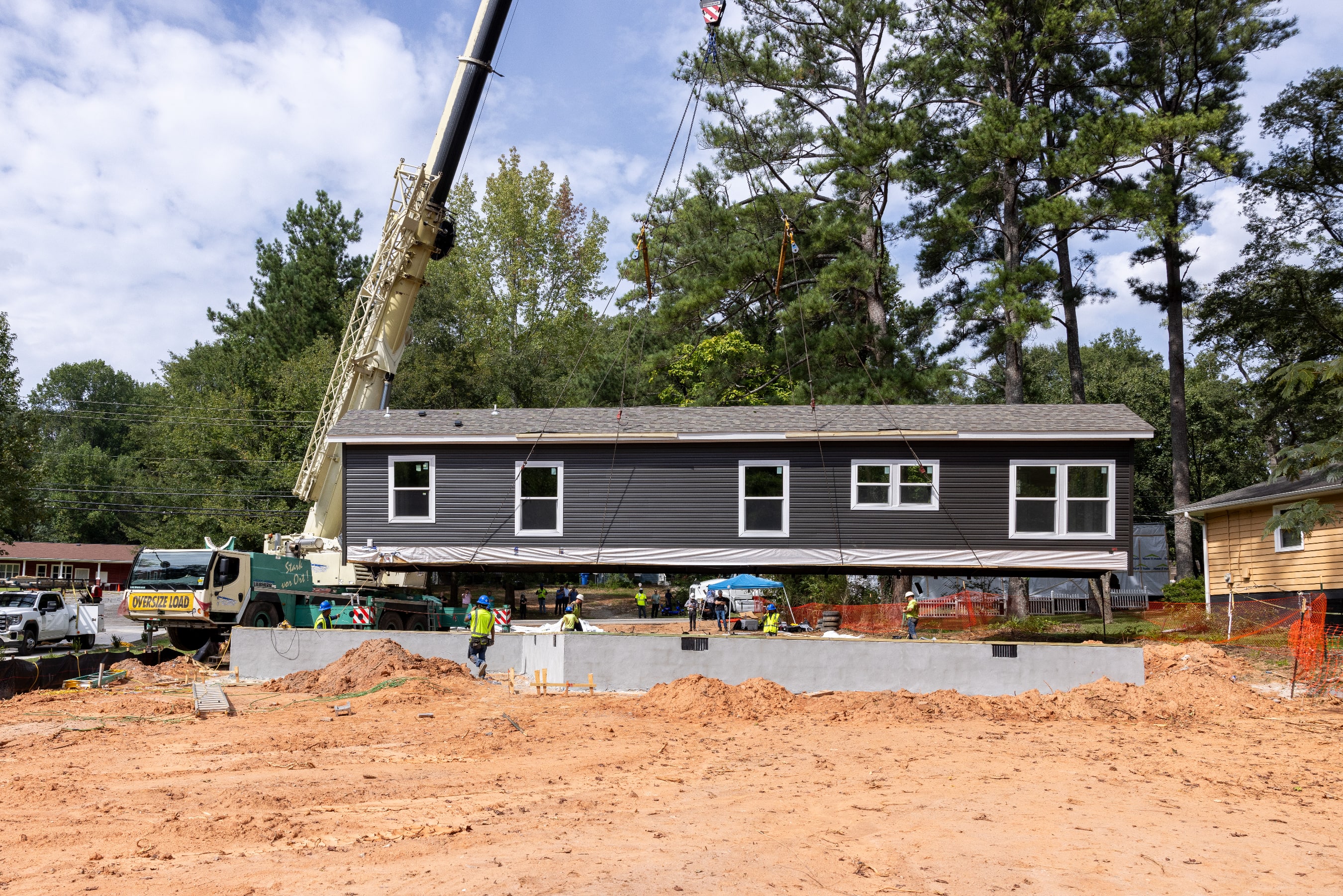 First built in a facility, CrossMod homes are set by crane on a permanent foundation.