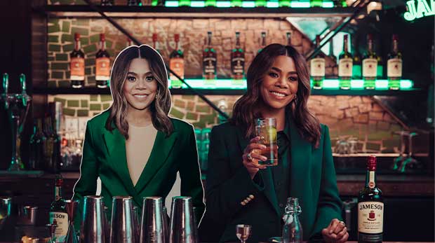 Irish Whiskey lover Regina Hall enjoys one of her favorite cocktails, Jameson Ginger and Lime, alongside her Jameson Desk Decoy: a personalized cardboard replica designed to stand in at work so she can enjoy her upcoming SPTO - St. Patrick’s Day Time Off - on March 17, guilt free.