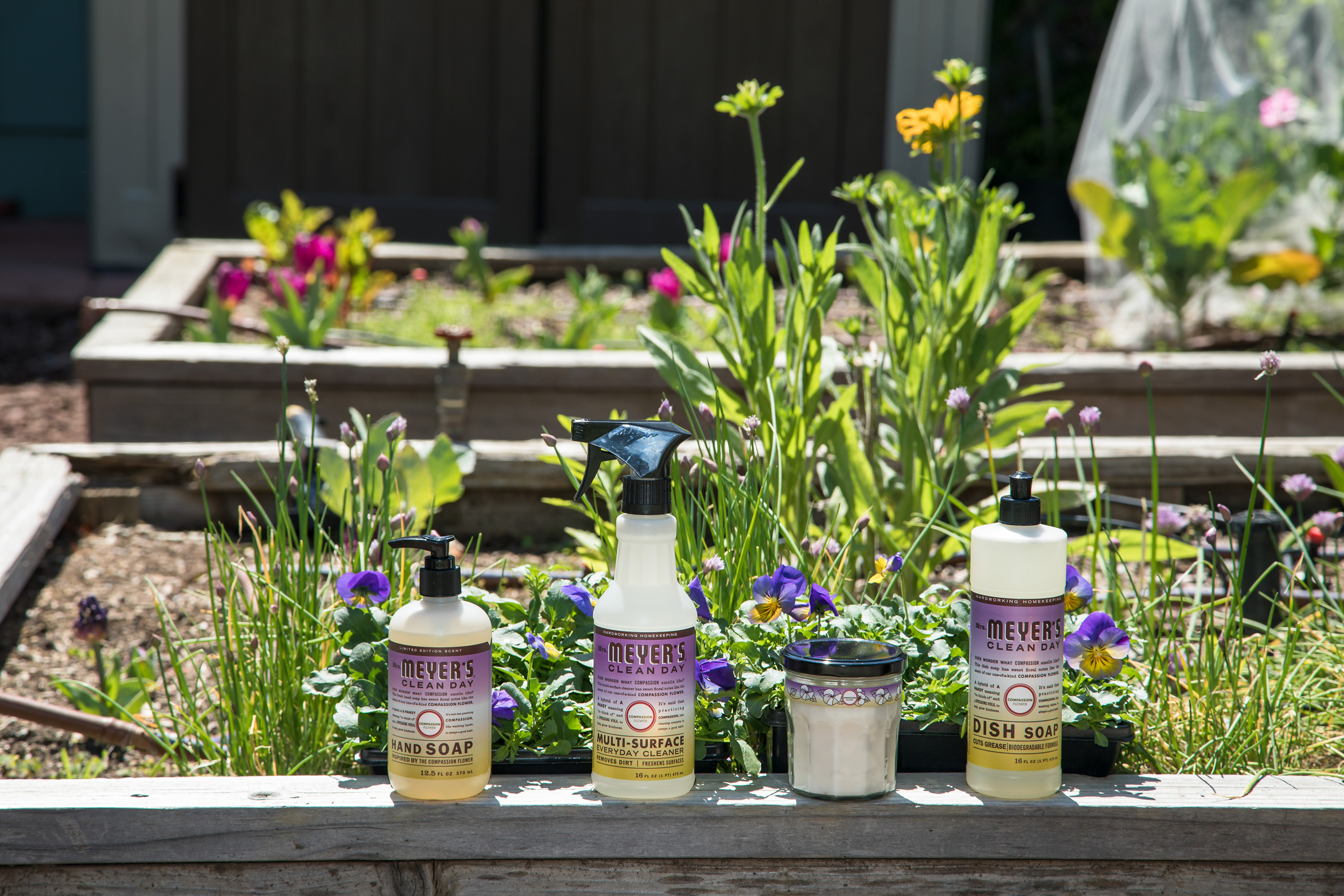 The Compassion Flower product line including the (from left to right) Hand Soap, Multi-Surface Everyday Cleaner, Large Soy Candle, and Dish Soap. Consumers can support the Lots of Compassion program by purchasing Mrs. Meyer’s Clean Day Compassion Flower products, with $1 from each product sold (up to $200K annually), benefitting community garden efforts throughout the country.