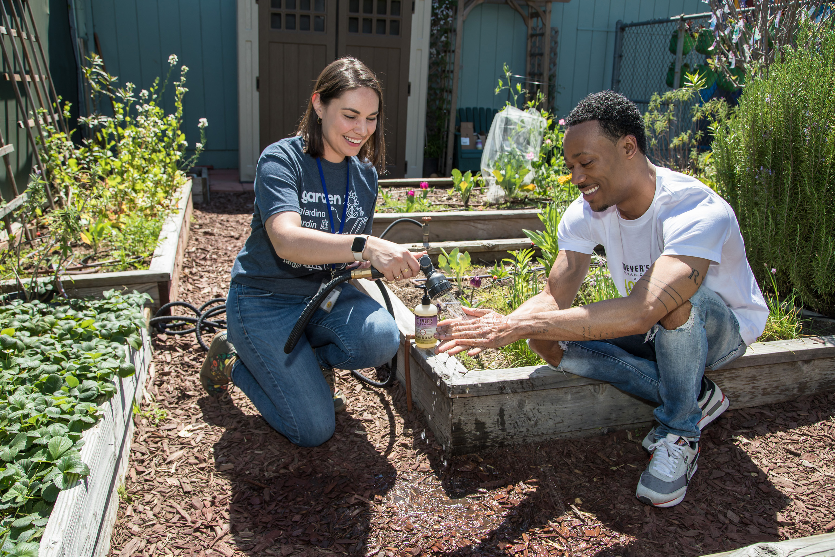 Tyler James Williams washing up with Mrs. Meyer’s Clean Day’s fan favorite Compassion Flower Hand Soap after working in the garden on National Gardening Day.
