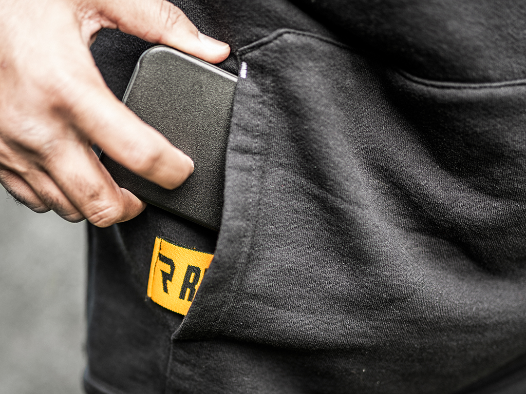 The hoodie from RealTruck features a jacquard elastic phone holder to keep phones in place while working on trucks outdoors.