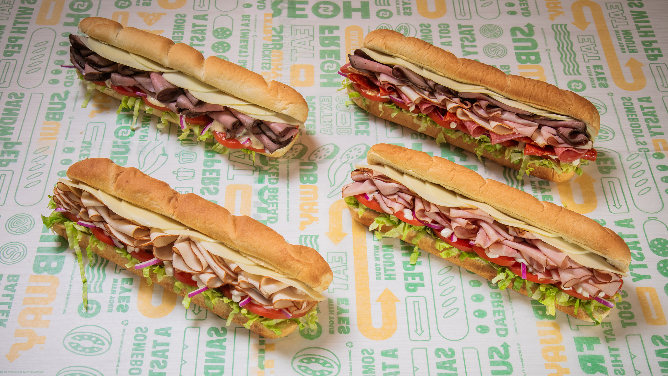 Subway’s four new Deli Hero subs are piled with more meat and cheese, showcasing the brand’s new freshly sliced meats.